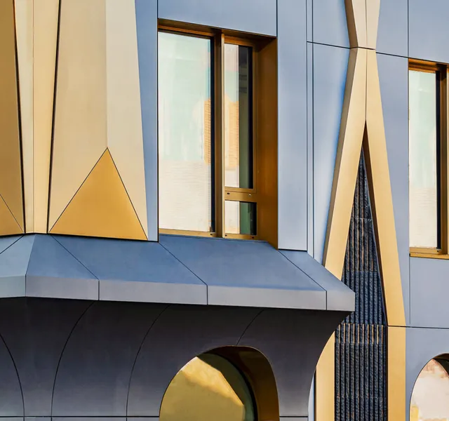 Accents of metal inserts reflect sunlight from different angles, creating a complex pattern of light and shadow — in keeping with the ornamental Art Deco tradition.